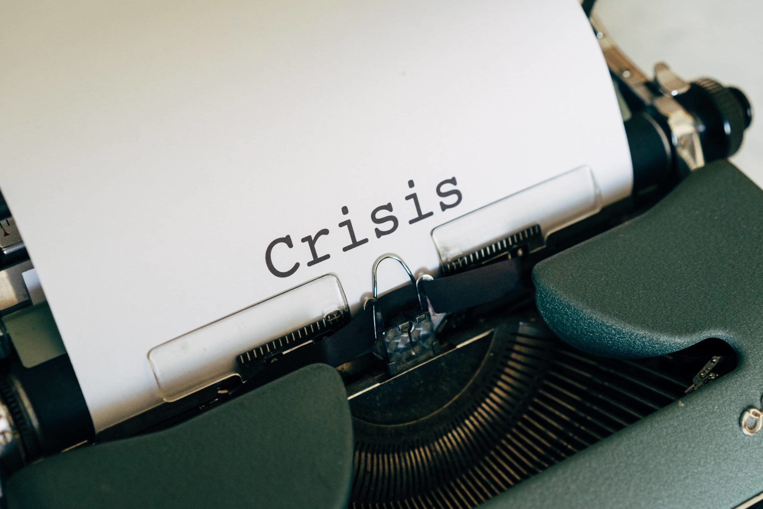 Image of the word crisis on a typewriter